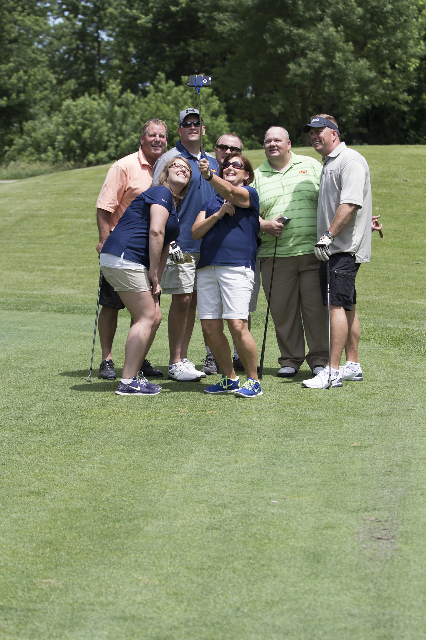 Carol Waldschmidt uses a selfie stick to take a photo
